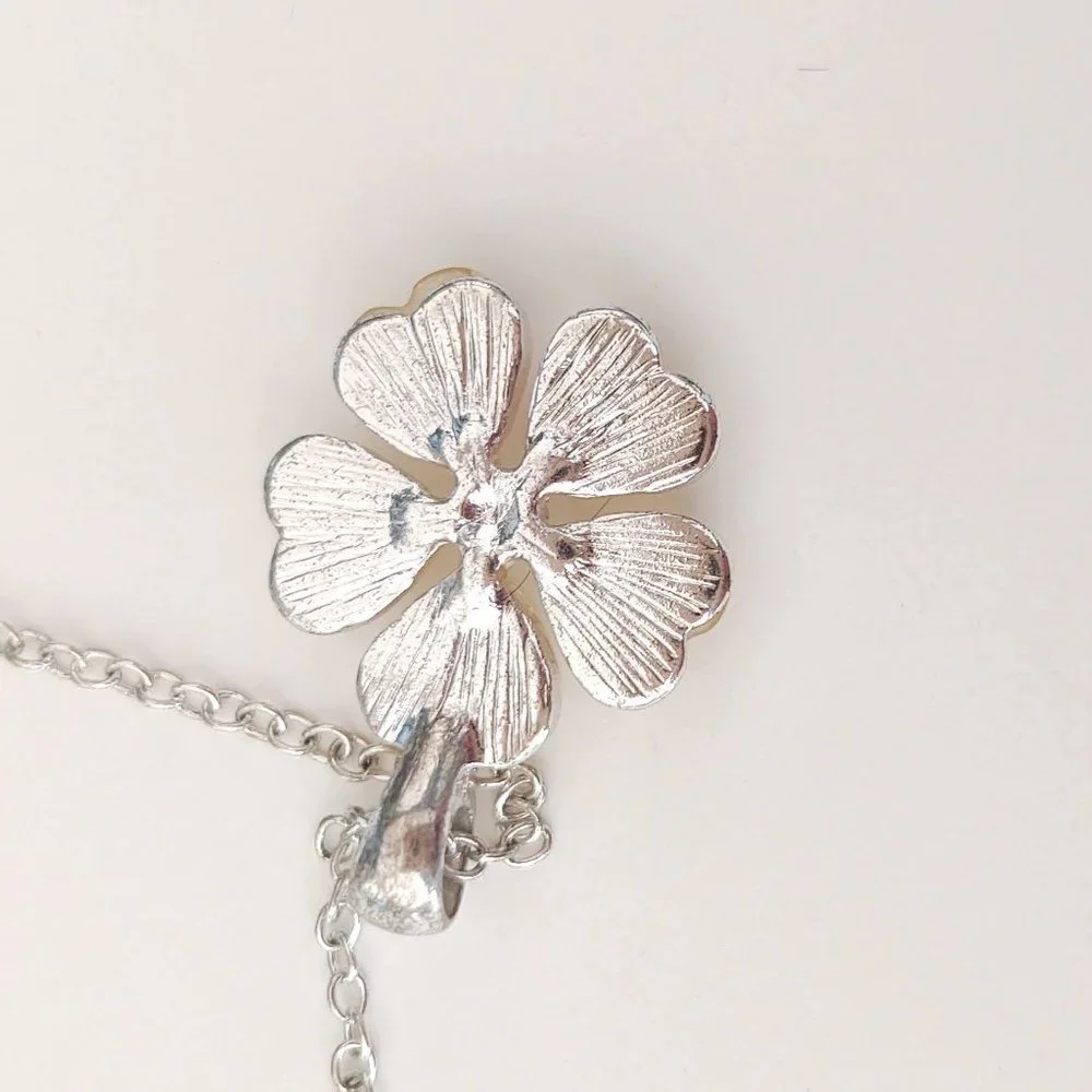 Cream flower pendant necklace with cz center and silver accents